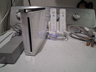 Nintendo Wii video game console.  with 2 controllers and charger. Good condition.  No games.