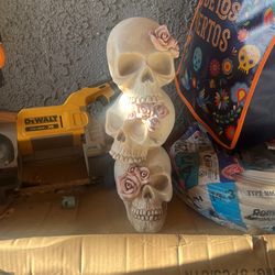 Stacked Skulls With Pink Roses