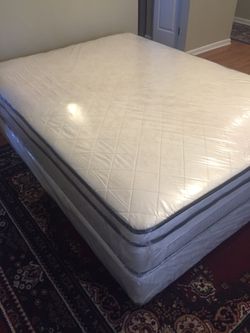 Queen size bed. New pillow top mattress and box springs.