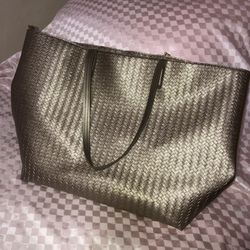Bath and Body Works XL metallic bronze tote bag. One strap is about to come undone t the stitching. Can be fixed. 21.5”x14”6” straps: 11”
