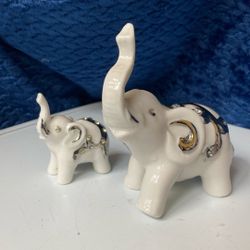 Two ceramic elephant figurines