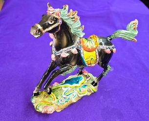 Coloful Painted porcelain or resin galloping horse sculpture.