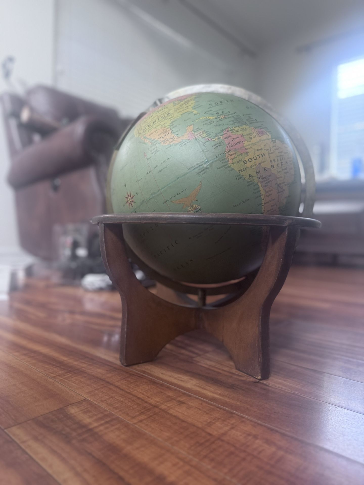 Vintage 12 inch globe with wooden stand