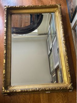 Antique Victorian gilt beveled mirror, ornate wood, and Gesso frame