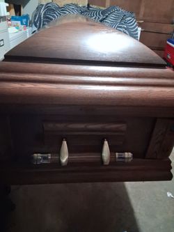 Full size hardwood coffin.