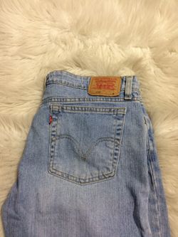 Women's Levi super low stretch denim,small hole near bottom pant leg as shown size 13