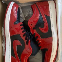 Jordan 1 Low Black Varsity