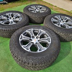 BRAND NEW CHEVY SILVERADO/ GMC SIERRA WHEELS WITH NEW GOODYEAR WRANGLER AT TIRES 265/65R18