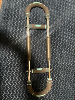 Twister arm trainer for chest development