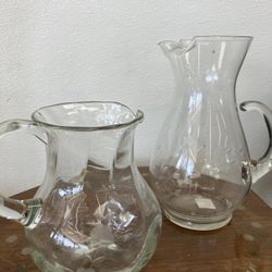 Two vintage glass pitchers
