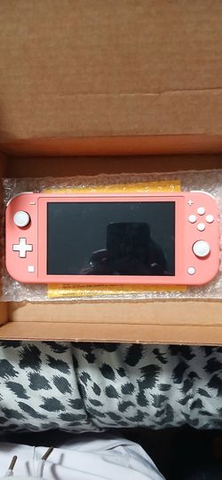 Pink Nintendo Switch with game