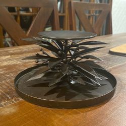 very nice base for a candle measures 4" tall