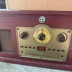 Electro Brand 5 in 1 vintage audio player plays am/fm radio, cd, turntable record player, casette, and aux.