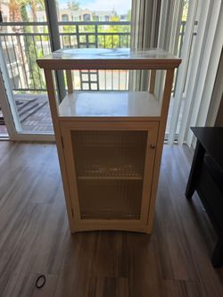 Storage cabinet with glass door