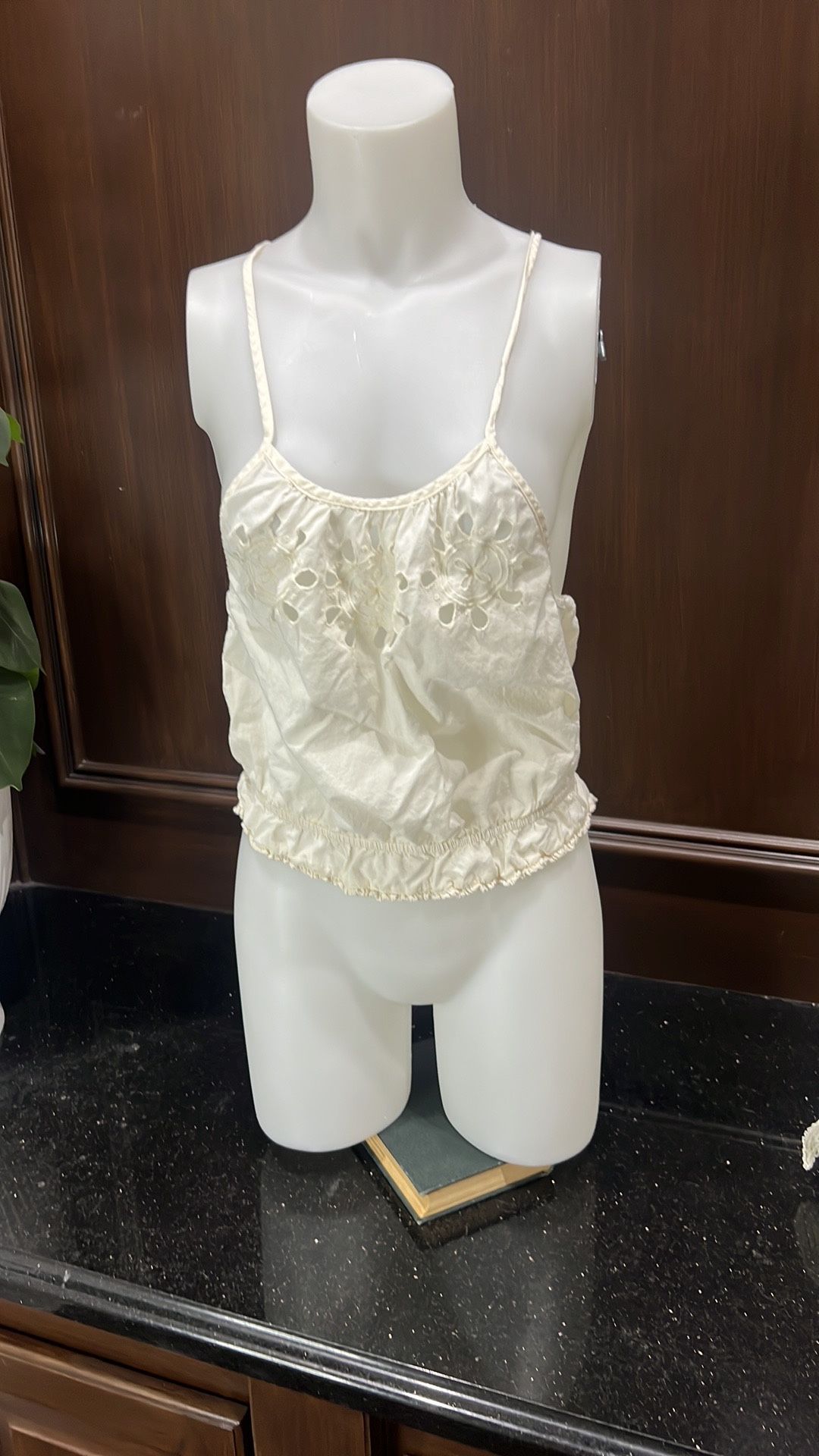 Aerie Halter Top size small Gently preloved Elegant cream camisole top with delicate embroidery. Features a ruffled hem and thin straps.
