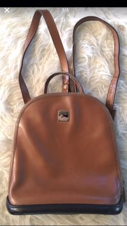 Vintage parasole camel brown Dooney and Bourke leather backpack shows signs of minor wear still in great condition 10"X3.5"X11"