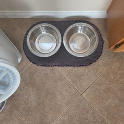 Two Dog Bowls And Bowel Mat