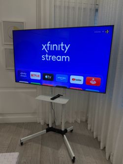 Sony Bravia 65” 4K Smart TV with Rolling Stand. Model XBR-65X900F. Excellent condition.