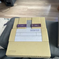 Working Super Nintendo (SNES) system with 7 games and all original cables.