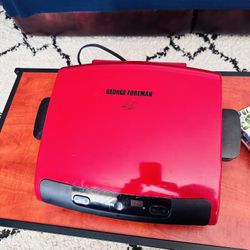 Red George Foreman grill in good condition.