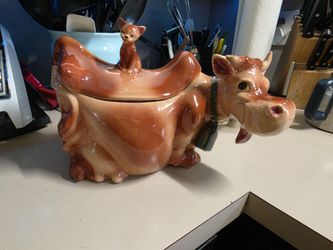 Vintage Cow Cookie Jar with a cat on its back