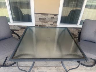 Patio table and 2 swivel chairs