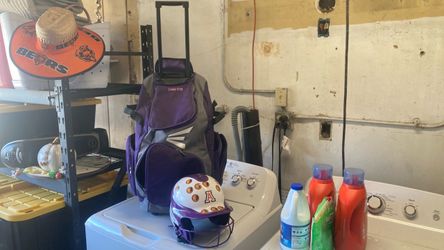 Helmet and Easton Purple Rolling Softball Bat Bag