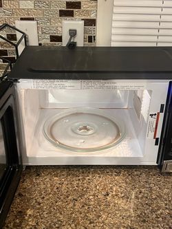 Microwave and metal wine rack