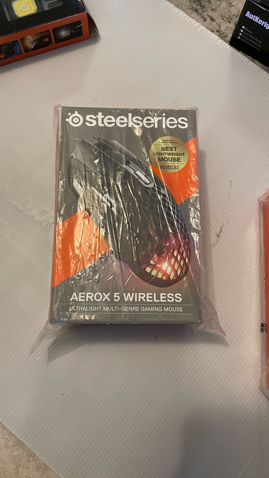)SteelSeries Aerox 5 Wireless - Holey RGB Gaming Mouse - Ultra-lightweight Water Resistant Design - 9 Buttons – Bluetooth/2.4 GHz - 18K DPI TrueMove
