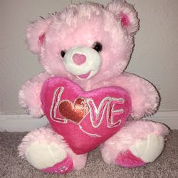 Pink teddy bear with heart 