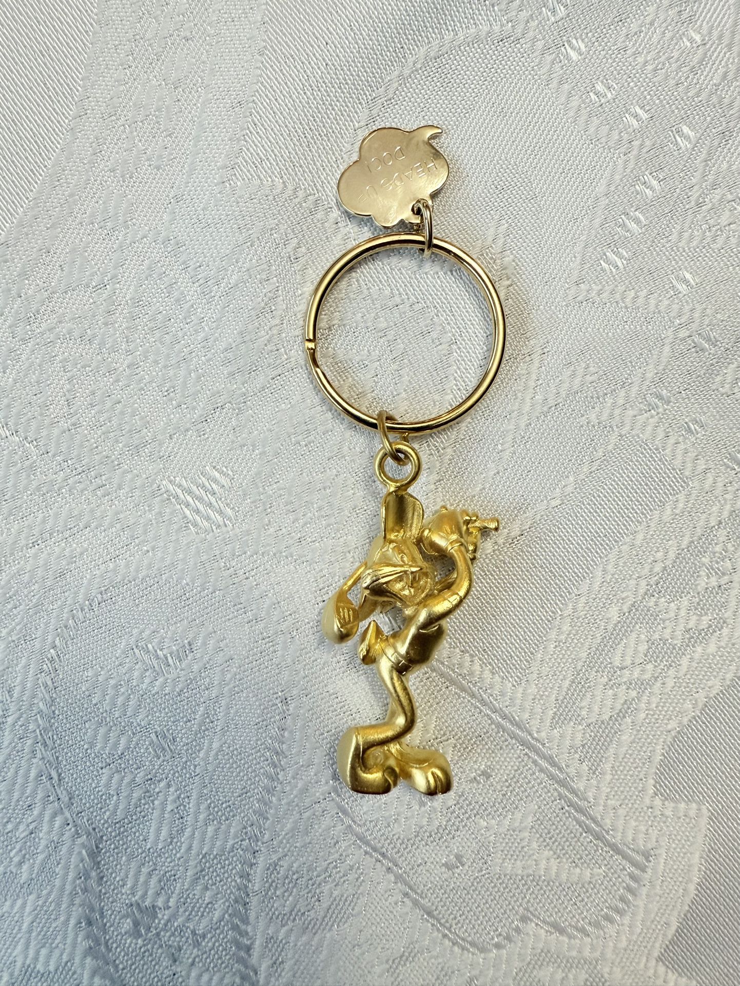 Beautiful Looney Tunes Bugs Bunny Golfing Keychain, Gold Tone W/ Tag “Heads Up Doc”. New. Never used.