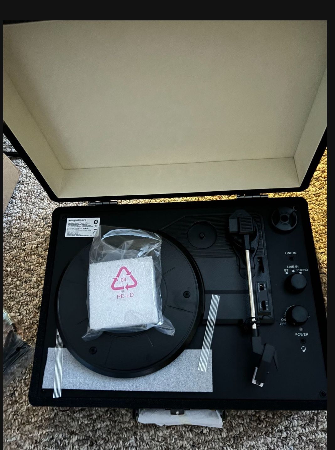 Amazon basics turntable record player with built-in speakers and Bluetooth.