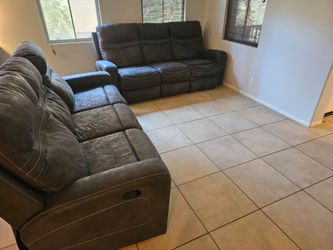 2 dark brown couches that recline ($500 for both)