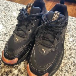 Puma rose gold and black shoes. Women's size 8.