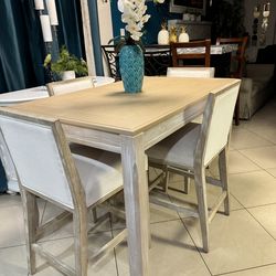 High Dining table 54” long 36” wide and 36” high  with 4 chairs in good condition