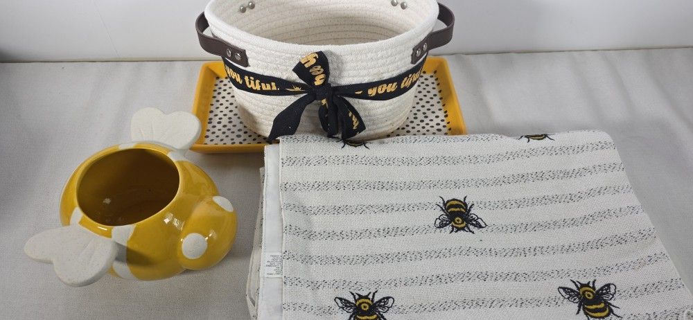 New Market Square
Embroidered Bees Striped Table Runners (2), A Bee Basket, A ceramic Bee And A Ceramic Platter..