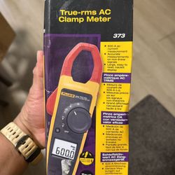 Fluke FLUKE-373 Clamp Meter measures 600V AC and DC rms voltage, AC current, resistance and capacitance.