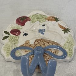 Howard Kaplan's ceramic Easter wall hook with rabbits and vegetables.