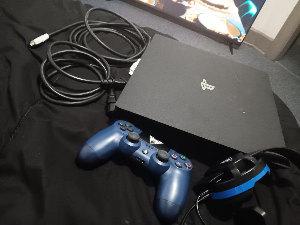 Tv And Playstation 4 With Head Phones And Controller