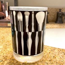 Vanity make up brush holder with brushes used as a design