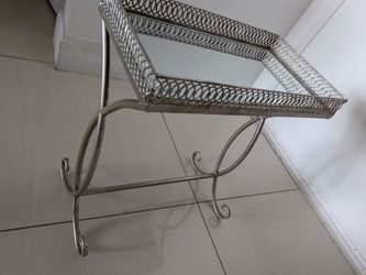 Side table mirrored glass top H 20" W 17" D 9.5". Color silver