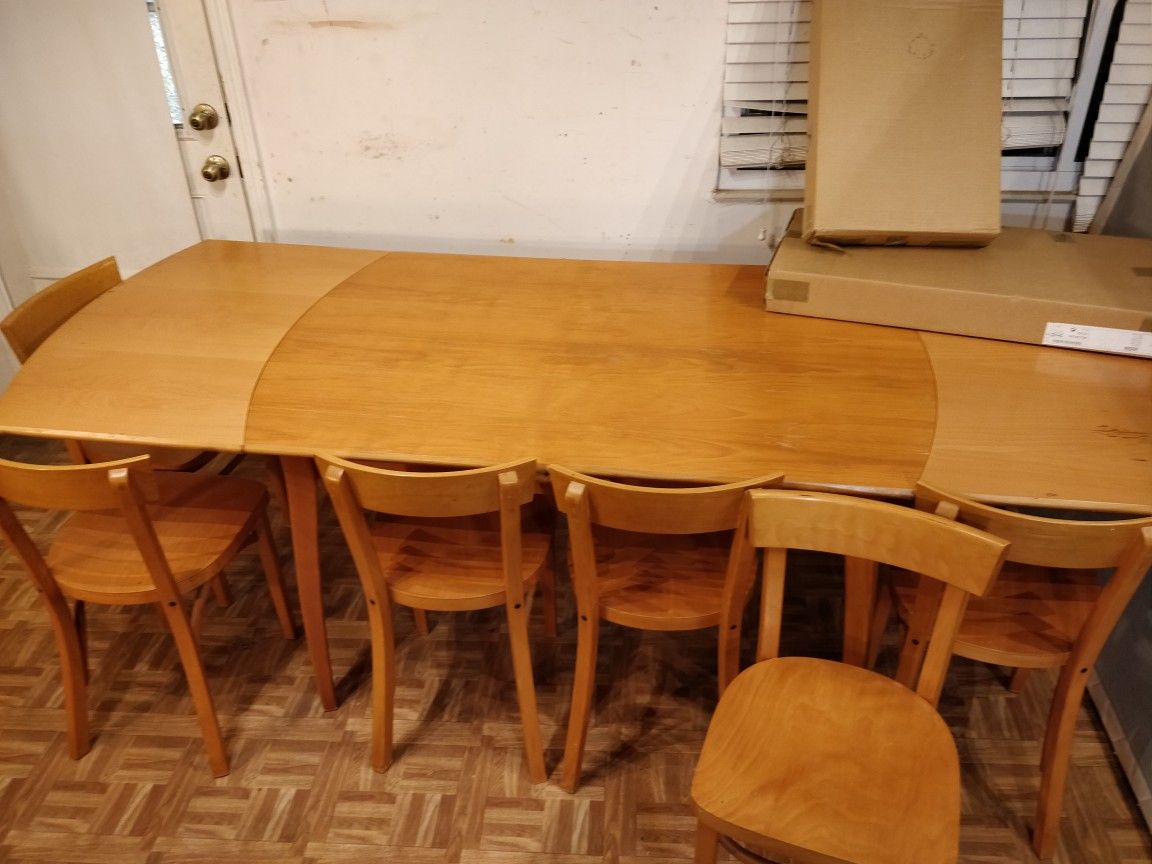Nice wooden dining table with 8 chairs in good condition, 2 chairs still in box. L(86/53)"*W35"*H29.5"