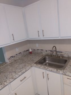 Two pairs of cabinet doors two for above microwave and two for sink