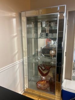 Glass curio with shelves