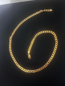 Elegant 24K Gold Curb Link Chain Necklace.  This piece has a classic flat link design and has a secure lobster claw clasp.