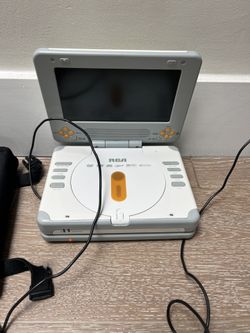 RCA portable DVD player along with over 100 almost new or new in packaging Blu-ray and DVD