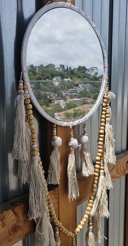 Boho wood beaded fabric wrapped mirror. Cream with tassels.
Beautiful condition 
Low price