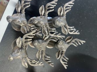 Set of seven metal deer shot glasses