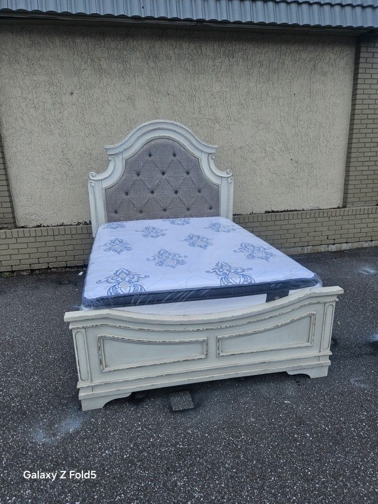 Queen Size Realyn Upholstery Bed Frame With Brand New Queen Size Plush Pillow Top Serta Mattress And Box Spring In Plastic
