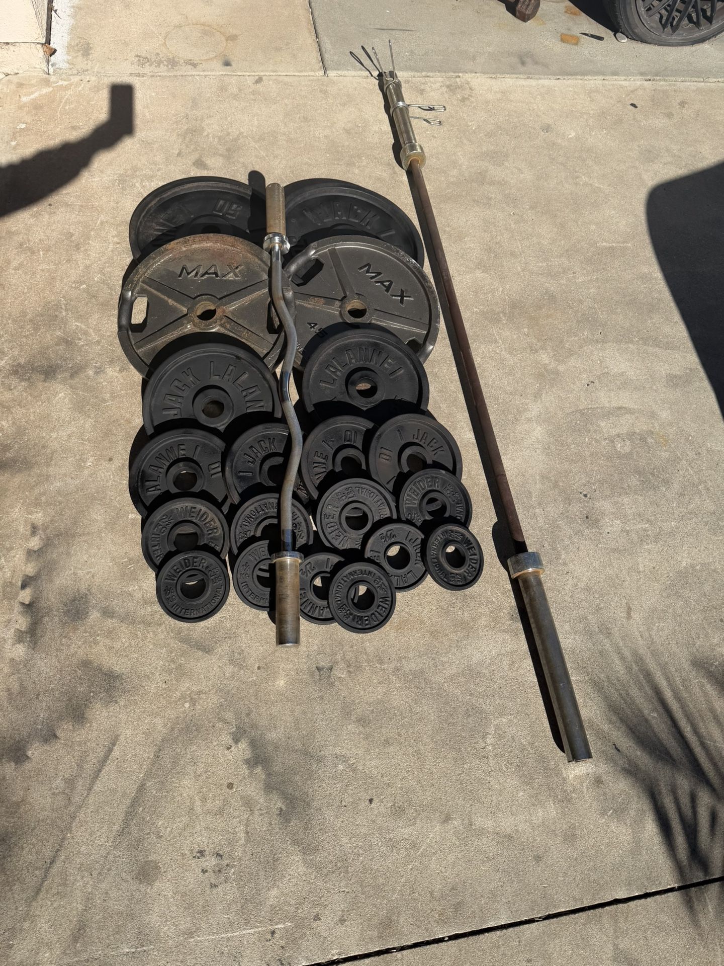 Olympic weight plates 315lbs plus 45lbs bar and curl bar